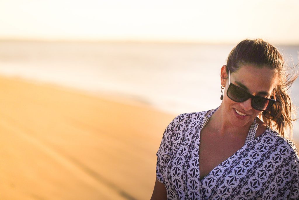 Woman with sunglasses at the beach