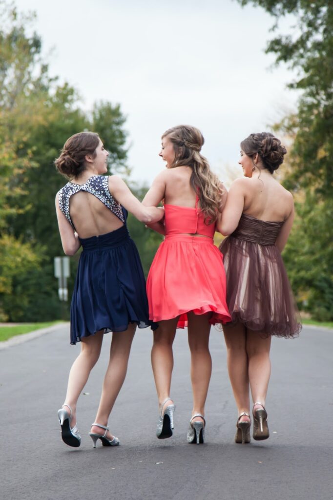 three girls wearing skirts